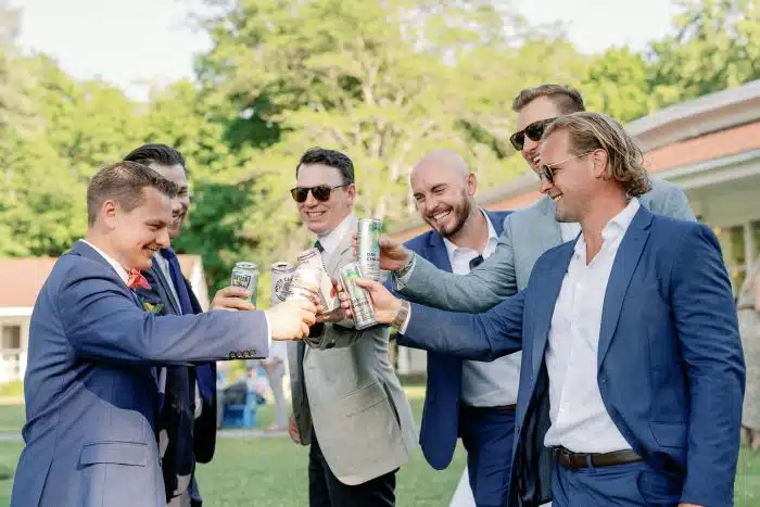 Group of groomsman enjoying drinks at the reception