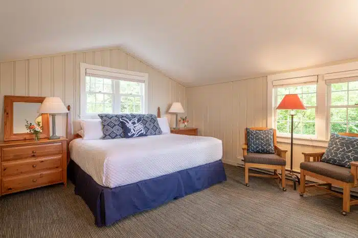 A bedroom with a king bed in one of the accommodations