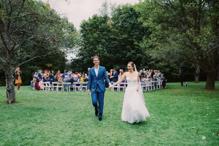 A bride and groom leaving their wedding ceremony