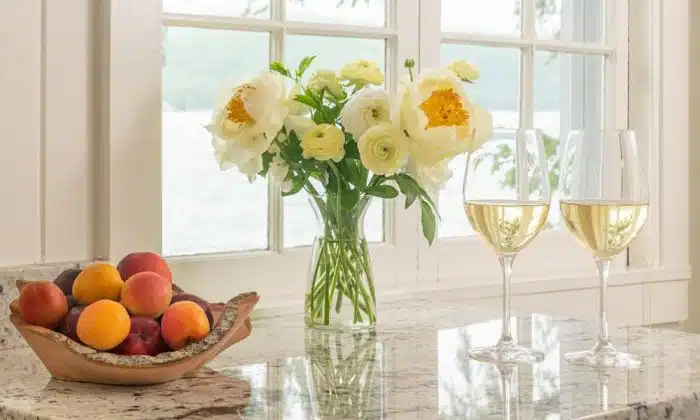 Stone fruit basket with flower arrangement picture