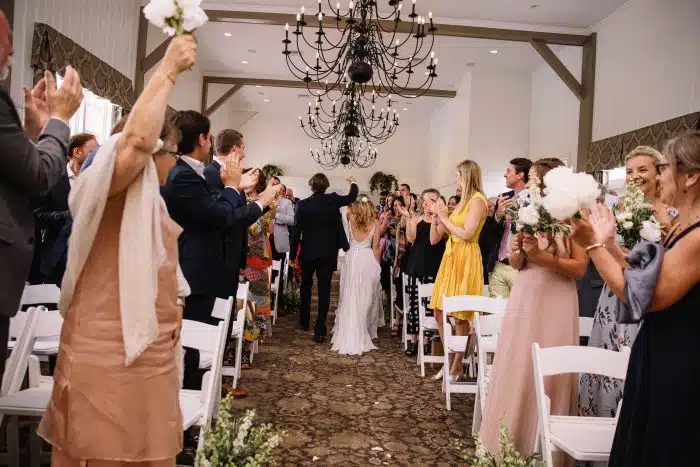 A couple leaving their wedding ceremony