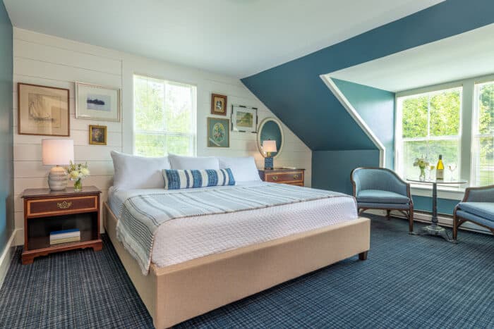 A bedroom with a king bed in one of the accommodations