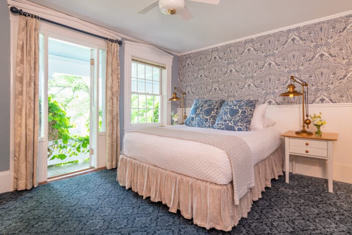 A room with a queen bed in one of the accommodations