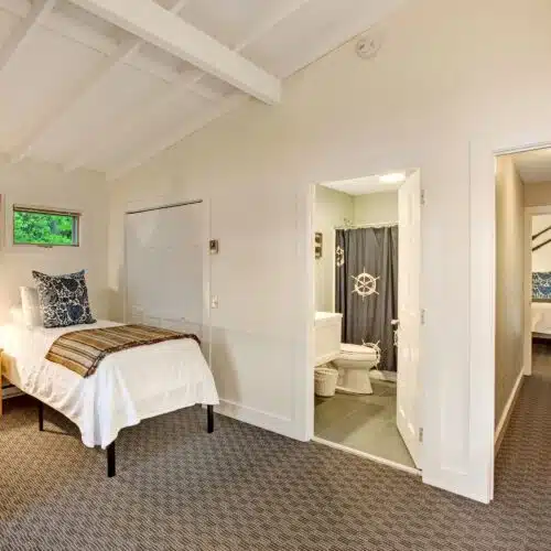 A bedroom with a twin bed in one of the accommodations