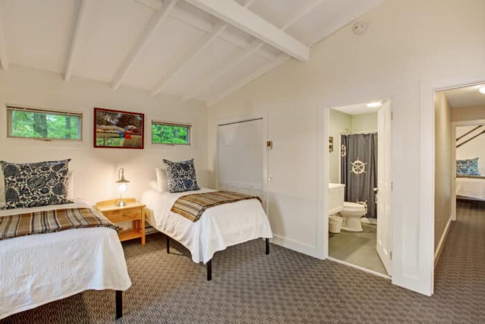 A bedroom with two twin beds in one of the accommodations