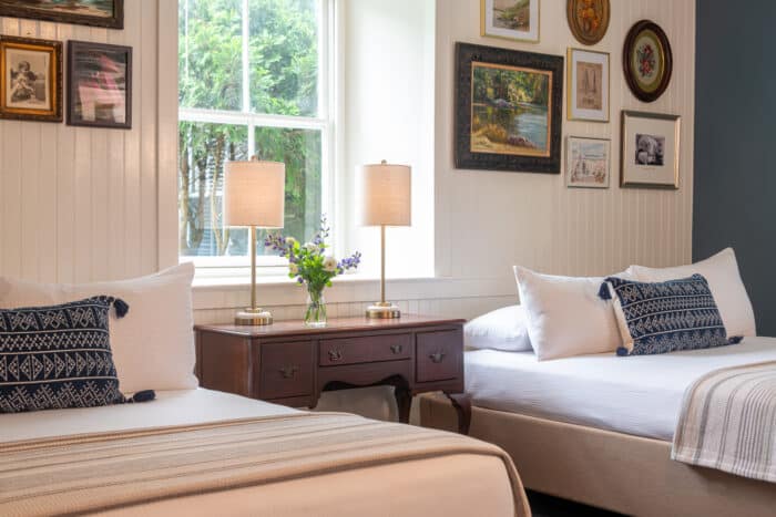 A bedroom with two queen beds in one of the accommodations