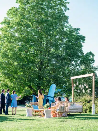 People mingling outside at a wedding reception