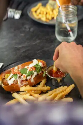 A person eating at the Red Mill
