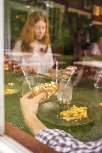 A family enjoying a meal at the Red Mill
