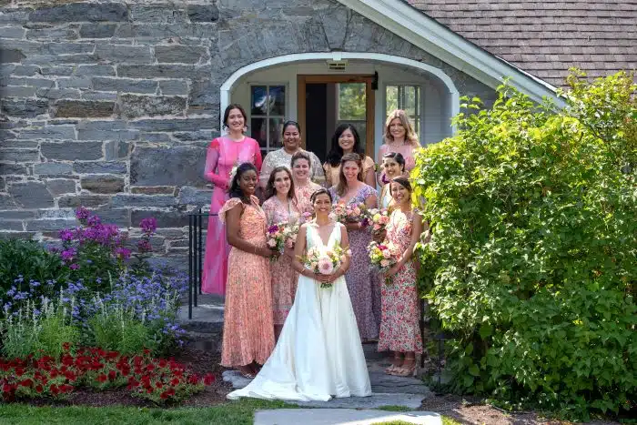 The bride and her wedding party in front of an accommodation